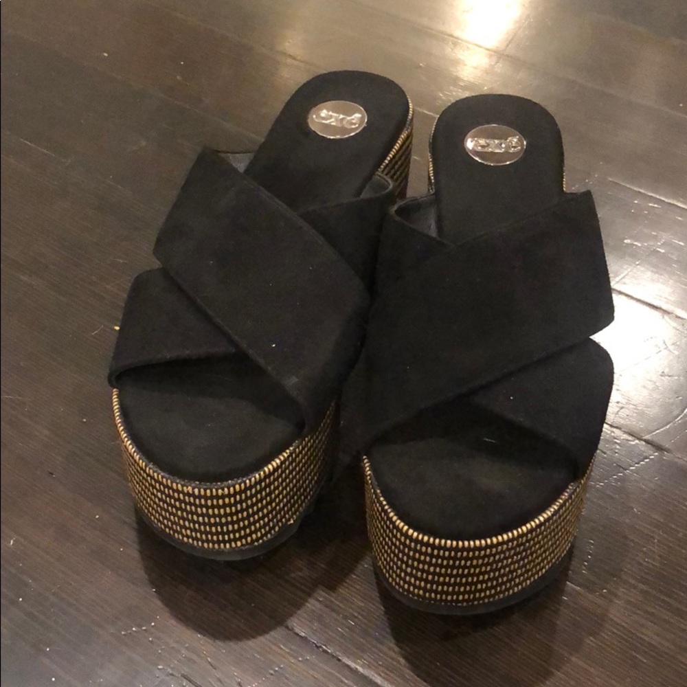 A pair of platform Exe sandals- European brand.